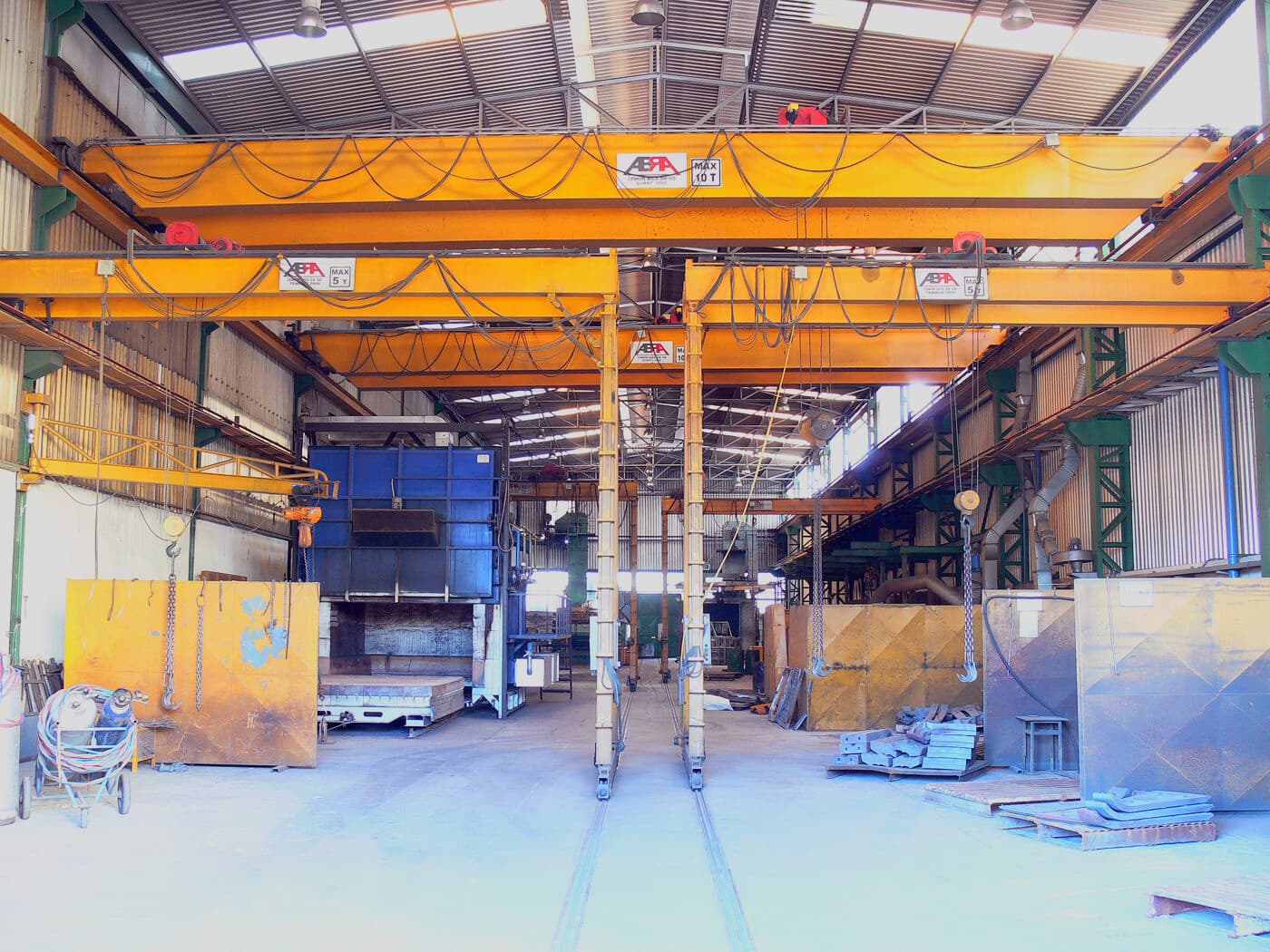 ABRA single girder overhead cranes serving a machining and fabrication workshop