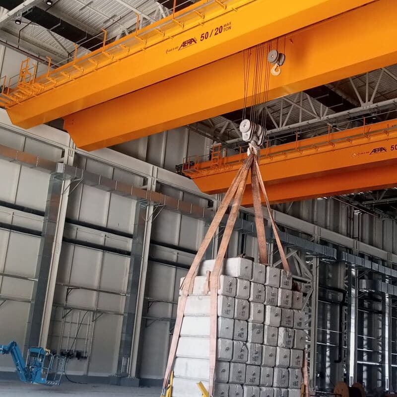 ABRA overhead crane lifting a slung load during site installation